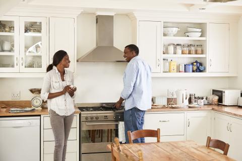 Couple enjoying their beautiful Refaced Kitchen Cabinets